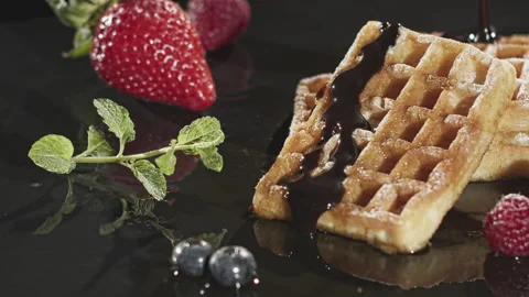 Pouring Chocolate over Waffles Stock Footage 135654868