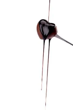 Pouring chocolate syrup Stock Photos