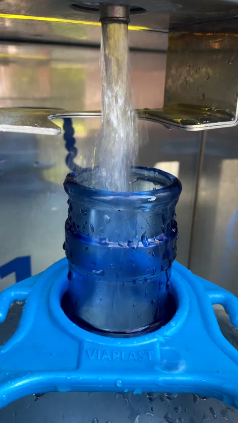 Pouring clean water in big bottle Stock Footage 197546557