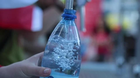 Pouring clean water into plastic bottle Stock Footage 51891355