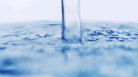 Pouring clear water to a plastic bottle Stock Footage 73609873
