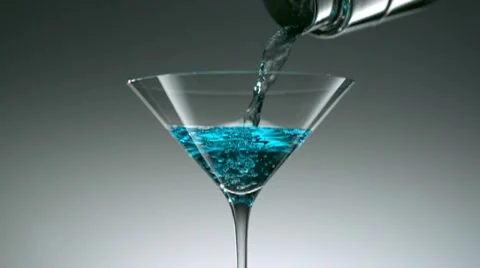 Pouring cocktail into martini glass, Slow Motion Stock Footage