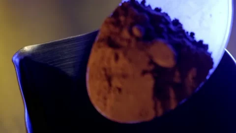 Pouring cocoa into the pitcher. Slow motion. Stock Footage 183969197