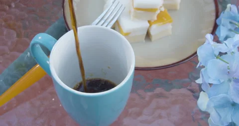 Pouring coffee on backyard outdoor table Stock Footage 131929321