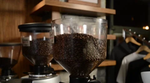 Pouring Coffee Beans into Container Stock Footage 68151886
