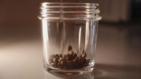 Pouring coffee beans into grinder, close-up Stock Footage 327285270