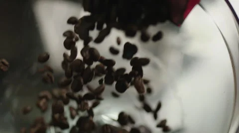 Pouring Coffee Beans into Grinder Stock Footage 54266870
