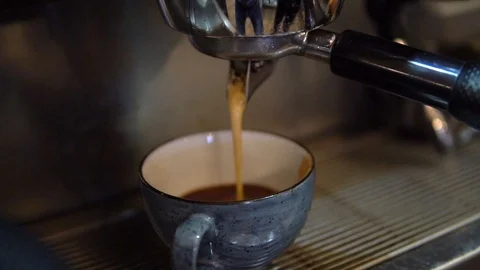 Pouring coffee from the coffee machine. 스톡 동영상 86065464