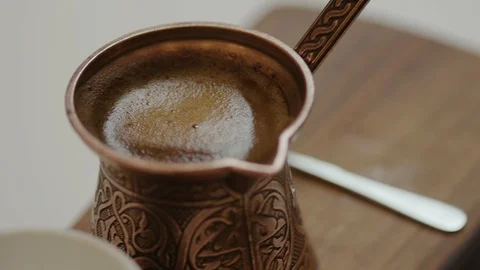 Pouring coffee in a cup, 4k slow motion Stock Footage 98881607