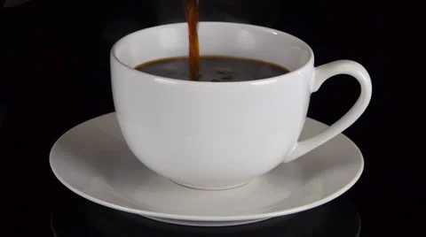 Pouring Coffee into a Cup Angled View Stock Footage 29269060