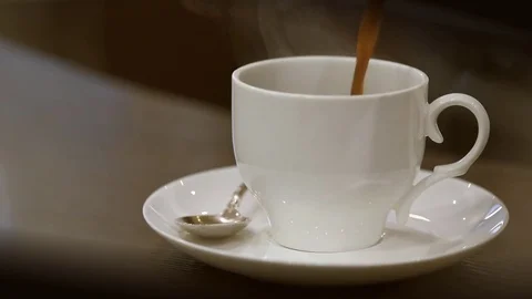 Pouring coffee into cup . Stock Footage 84204162