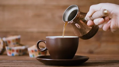 Pouring coffee into a cup . Stock Footage 87519038