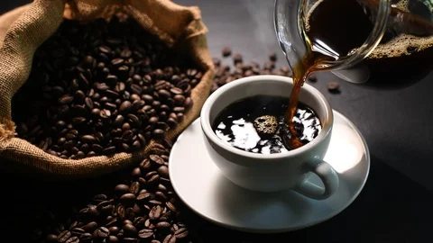 Pouring coffee into a cup Stock Footage 128722547