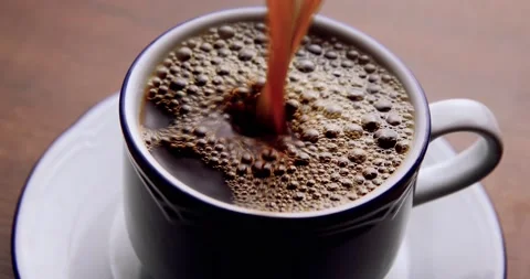 Pouring coffee into the cup Stock Footage