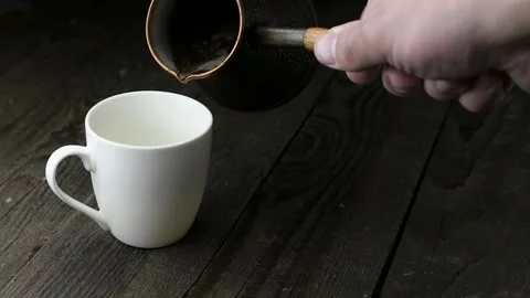 Pouring coffee into a cup Video stock 166586971