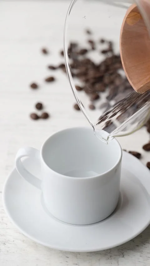 Pouring coffee into a cup Stock Footage 273638818