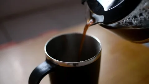 Pouring coffee into a cup on Stock Footage 285582288