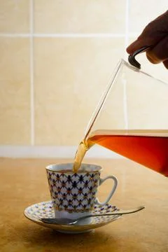 Pouring Coffee in a Cup Stockfoto's