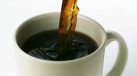 Pouring coffee into cup, Slow Motion Stock Footage 12564599