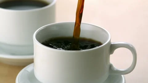Pouring coffee into cup, Slow Motion Video stock 12564838