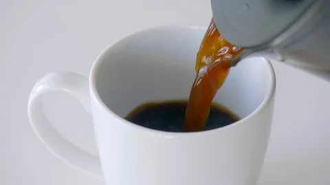 Pouring coffee into cup slow motion in 4k 60fps Stock Footage 93159100