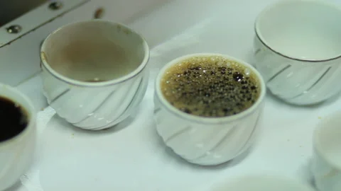 Pouring coffee in cups during a Buna tetu Stock Footage 169700998