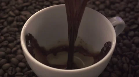 Pouring coffee on dark background Stock Footage 56174347