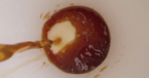 Pouring Coffee into Empty Cup. Top View of Coffee Being Poured in Slow Motion Video stock 166660775
