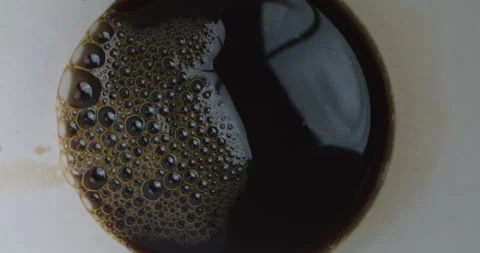 Pouring Coffee into Empty Cup. Top View of Coffee Being Poured Stock Footage 166811436