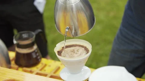 Pouring coffee into filter slow motion Stock-Footage 157577949