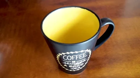 Pouring coffee in mug Stock Footage 104353167