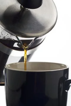 Pouring coffee in mug Foto stock