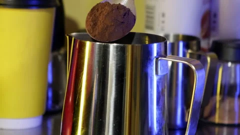 Pouring coffee into the pitcher. Slow motion. Stock Footage 183969281