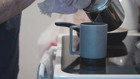 Pouring coffee from pot into mug Stock Footage 288349491
