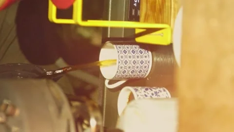 Pouring coffee into small cup at night. Camping near campfire. vertical video Stock Footage 207432148