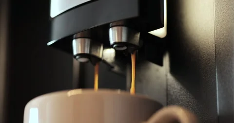 Pouring coffee stream from automatic professional machine in cup. Drinking Stock Footage 252754325