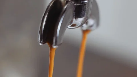 Pouring coffee stream from machine in cup. Barista man making espresso. Stock Footage 112681961
