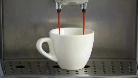 Pouring coffee stream from machine in cup. Stock Footage 142500221