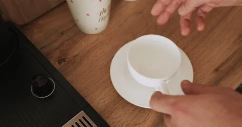 Pouring coffee stream from machine in cup.  Stock Footage 144394489