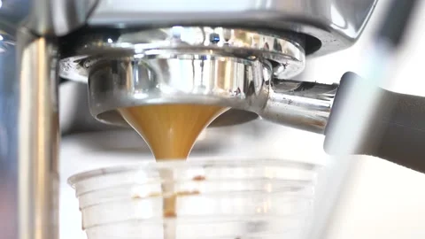 Pouring coffee stream from machine in cup. Stock-Footage 156708766