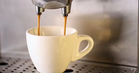 Pouring coffee stream from machine into a cup. Stock Footage 170017634