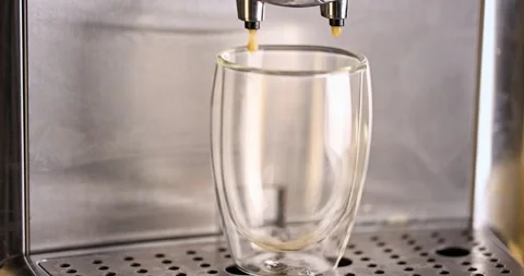 Pouring coffee stream from machine into a cup. Stock Footage 170017728