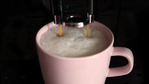Pouring coffee stream from machine in cup. Stock Footage 276906228