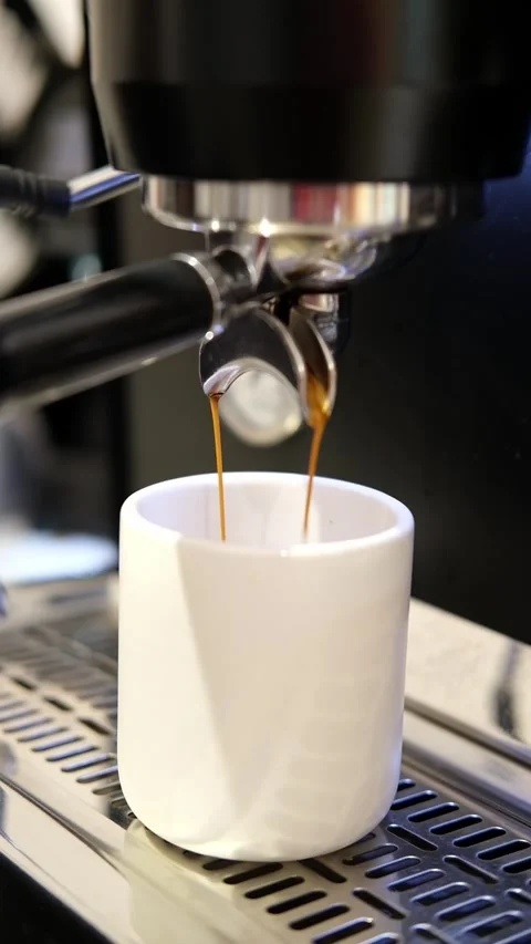 Pouring coffee stream from machine in cup. Cafe making hot Espresso. Using Stock-Footage 280762880