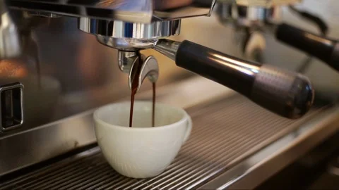 Pouring coffee stream from professional machine in cup Stock Footage 108883607