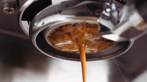 Pouring coffee stream from professional machine in cup. Barista making espresso. Stock Footage 112680867