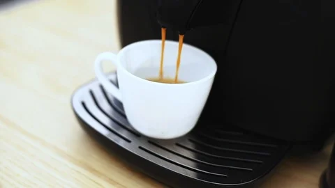 Pouring coffee stream from professional machine in white cup. Stock Footage 120565203