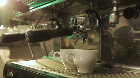 Pouring Coffee Stream from Professional Machine in Two Cup. Barista making Stock Footage 195241999