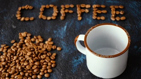 Pouring coffee surrounded by coffee beans 스톡 동영상 101148264