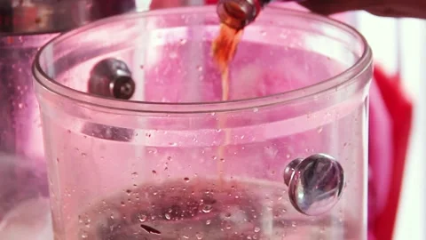 Pouring cola in the container Stock Footage 272594260